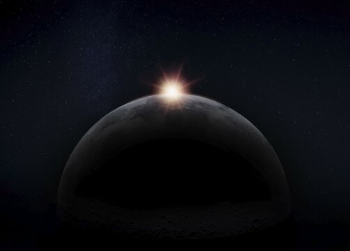 View of the dark hidden side of the Moon with the Sun behind it. Negative space for copy text. Elements of this image furnished by NASA