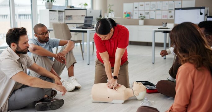 First aid, cpr training or people with dummy for safety compliance, health or chest compression for breathing. Paramedic course, medical demonstration or teaching emergency rescue technique in office