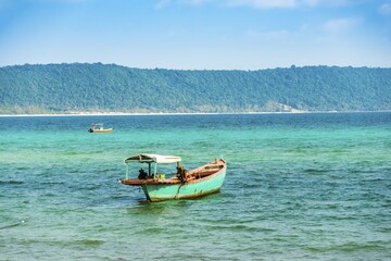 Fototapeta premium Traditional long-tail boat in turquoise sea, Long Beach, Sok San Village, Koh Rong Island, Krong Preah Sihanouk, Sihanoukville, Cambodia, Asia