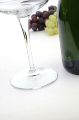 Glass of wine with bottle