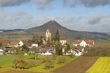 The village of Weiterdingen and the volcanic rock hohenhewen - Baden Wuerttemberg, Germany,...