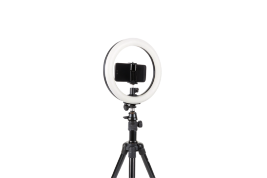 A professional tripod-mounted LED light surrounds a smartphone, symbolizing modern content creation tools, isolated on a transparent background