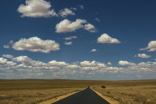 Road with cloudy sky, Plateau Isalo at Ranohira, Madagascar, Africa