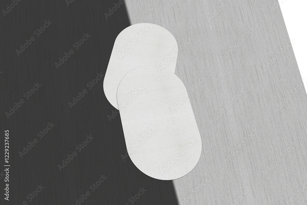 Aufkleber two white elliptical shapes overlapping with a sharp light and shadow contrast, blank white business