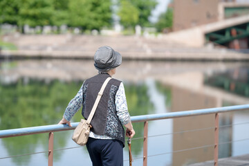 A park with good atmosphere with canal in Toyama Prefecture. Old Japanese woman in her 90s are...