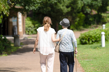 A park with good atmosphere with canal in Toyama Prefecture. Old woman in her 90s and Japanese...