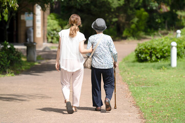 A park with good atmosphere with canal in Toyama Prefecture. Old woman in her 90s and Japanese...