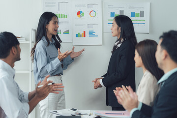 Successful Presentation: A charismatic businesswoman delivers a compelling presentation to her...