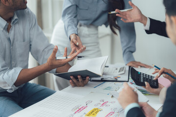 Collaborative Brainstorming Session: A close-up shot focusing on hands and documents during an engaging brainstorming session. Colleagues actively participate, ideas flow freely.