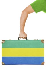 The Gabonese flag on a suitcase. Isolated on white