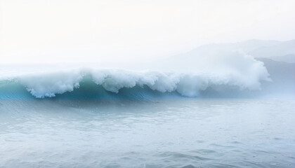 Waves crashing on tranquil water against a misty background