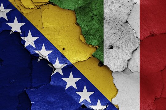 Flags of Bosnia and Herzegovina and Italy painted on cracked wall