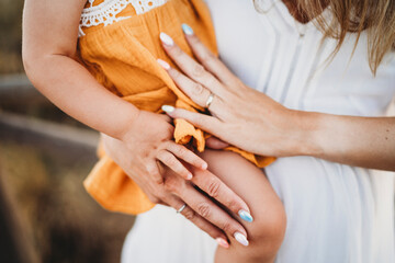 Close up hands mom toddler girl daughter