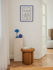 Stylish corner with a sculptural stool, bold artwork, and vibrant accents. A perfect blend of...