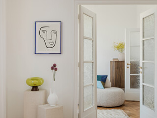 Modernist chair with woven seat and backrest against a minimal interior. Abstract art on the wall...