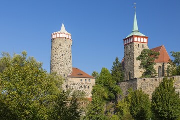 City walls near the Spree river with the tower of the Old Waterworks and St Michael's Church, Bautzen, Saxony, Germany, Europe