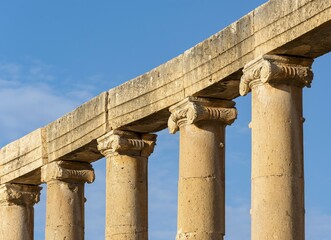 Fototapeta premium Close-up of columns and capitals at Oval Plaza, Forum, Jerash, Jordan, Asia