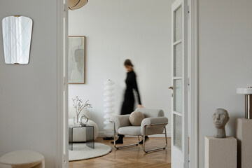 Elegant corner with a boucle armchair, minimalist decor, and soft lighting. A perfect balance of comfort and style.