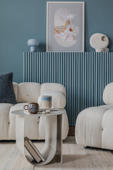 Scandinavian-inspired living room featuring a boucle sofa, soft textures, and a serene palette of blue and beige tones...