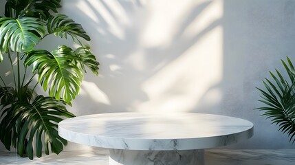 White round marble table features monstera deliciata plant leaves against white wall background. Soft natural lighting casts shadows, creating clean aesthetic in vertical composition.