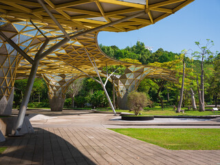 Infrastructure of the Kuala Lumpur Perdana Botanical Garden featuring walking paths, benches,...