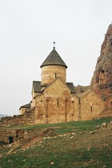 Fototapeta premium Historic Armenian Church with Mountain Backdrop