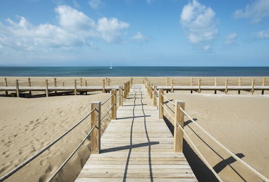 Wooden footbridges at the beach of Riumar, Ebro Delta Nature Reserve, Tarragona province, Catalonia, Spain, Europe
