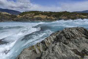 Rapids at the confluence of the turquoise Rio Baker and the glacier grey Rio Nef, between Puerto Guadal and Cochrane, Región de Aysén, Chile, South America
