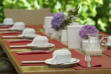 Table set for a celebration in the outdoor area of a restaurant