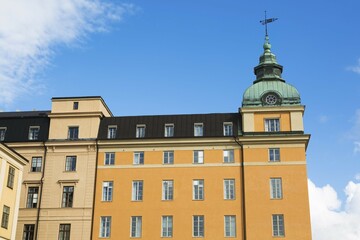 Old 1910 beige and orange architectural buildings with rows of windows, Gamla Stan, Stockholm, Sweden, Europe