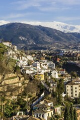 Naklejka premium View of Granada, Sierra Nevada with snow in background, Andalucía, Spain, Europe
