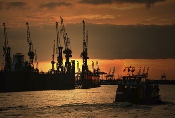 Sunset, harbor cranes and barge, harbor, Hamburg