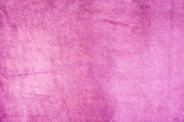 Raspberry pink suede background. Light pink purple suede leather macro photo.