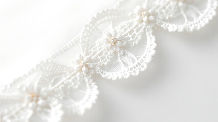 Elegant white lace detail showcasing stunning craftsmanship on a soft background.