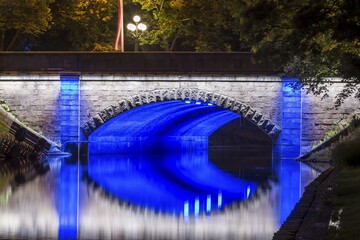 Illuminated bridge along the Pilsetas Canal, Riga, Latvia, Europe