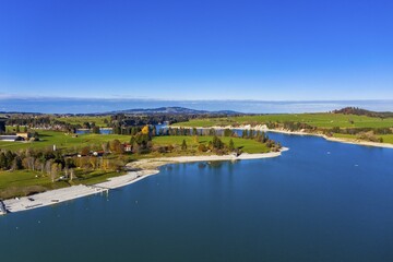 Drone shot, Reservoir Forggensee at low tide, Dietringen, region Füssen, Ostallgäu, Bavaria, Germany, Europe