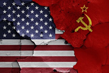 Flags of USA and Soviet Union painted on cracked wall