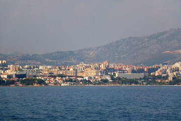 Fototapeta premium Contemporary buildings, gardens and beaches at the waterfront in Split, Croatia. View of Split from the boat.