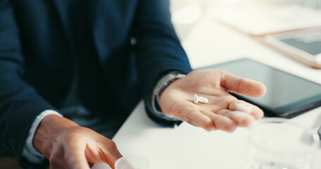 Business person, hands and pills for prescription, treatment or medical drugs for pain relief in office. Healthcare, anxiety and man with medicine, supplements or vitamins for pharmaceutical help