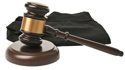 Dark Brown Gavel with Gold Accents Resting on Black Cloth