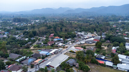 Aerial View of Rural Village with Mountainous Horizon in North of Thailand Chiang Mai