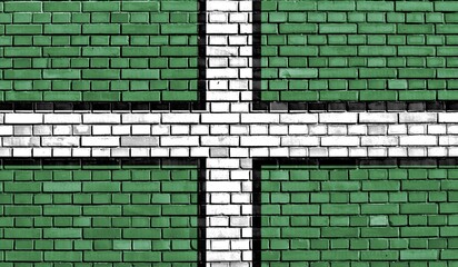 Flag of Devon painted on brick wall