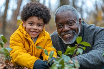 Grandfather and grandson bonding while gardening in a serene forest during autumn