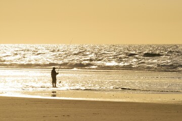 Fisher on the beach of the North Sea, Juist, East Frisian Island, East Frisia, Lower Saxony,...