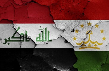 Flags of Iraq and Tajikistan painted on cracked wall