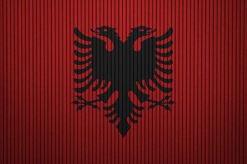 Albania flag painted on the cracked grunge concrete wall