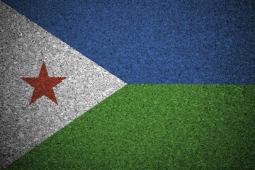 The Djibouti flag painted on a cork board