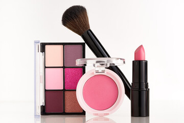 Makeup palette,  brush , pink lipstick and pink cheek blush.. Make up concept
