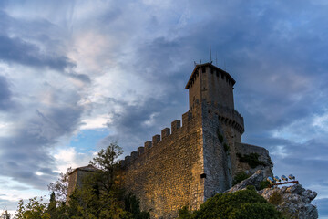 Fortress of Guaita under a cloudy blue sky in San Marino