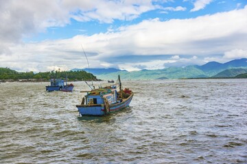 Fototapeta premium Blue fishing boats, fishing boats on the water, Nha Trang, Khánh Hòa Province, Vietnam, Asia